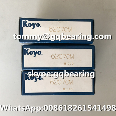 Gcr15 स्टील सामग्री जापान मूल KOYO 6207 6207CM एकल पंक्ति गहरी ग्रूव गेंद असर